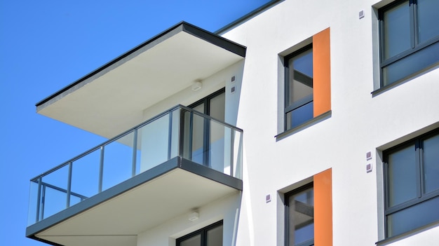 a house with orange trim and a balcony