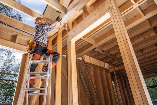 House Wood Frame Building by Contractor Worker