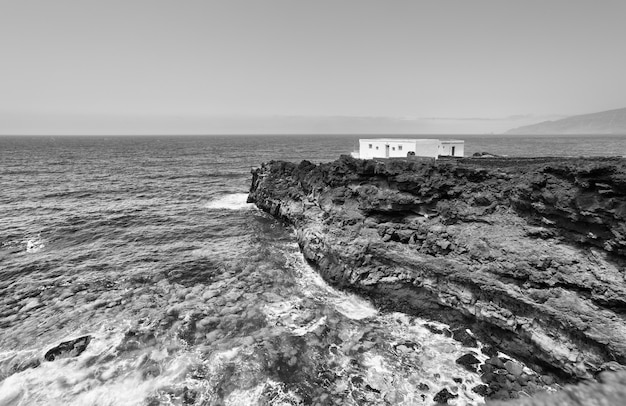 House at world's end. Lonely small house on a rocky shore of Atlantic Ocean.  El Hierro Island, Canaries