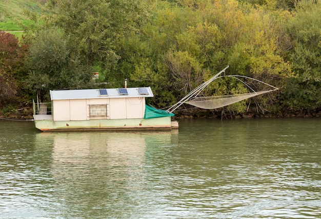 Houseboat used for dip fishing in River Danube