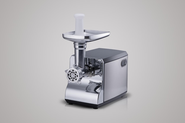Household electric meat grinder on a light gray background kitchen appliances