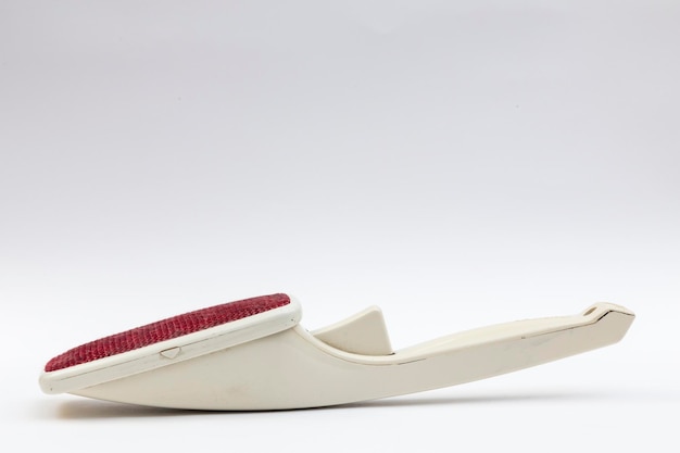 Household utensils brush remover placed on a white background