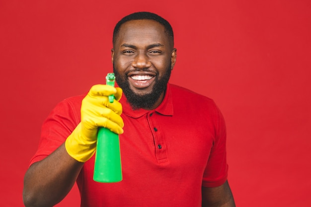 Householding concept. Young african american man cleaning using gloves 