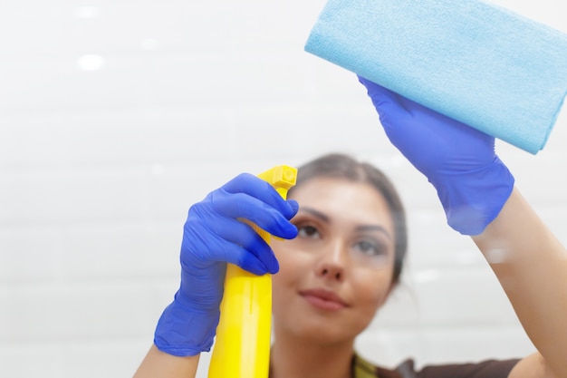 Housekeeper cleaning a hotel room