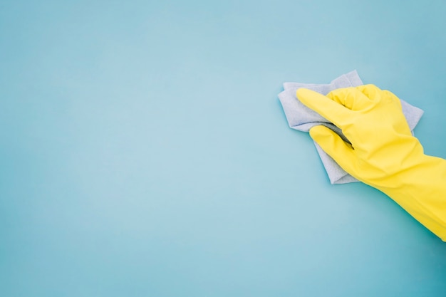 Photo housekeeping concept with hand holding cloth