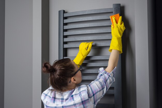 Housemaid woman is cleaning