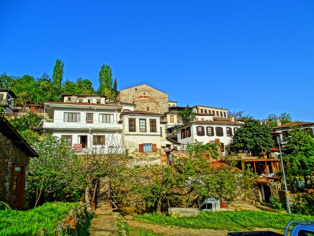 Houses against clear blue sky