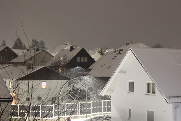 Photo houses against clear sky at dusk