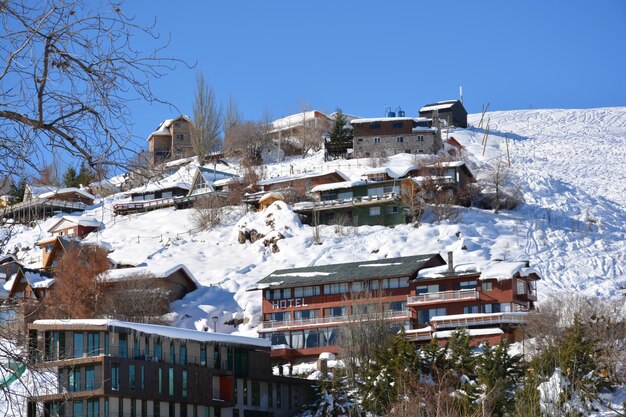 Houses against clear sky during winter