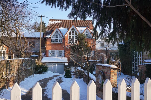 Houses against sky during winter