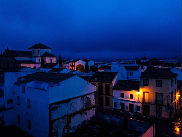 Houses against sky at night