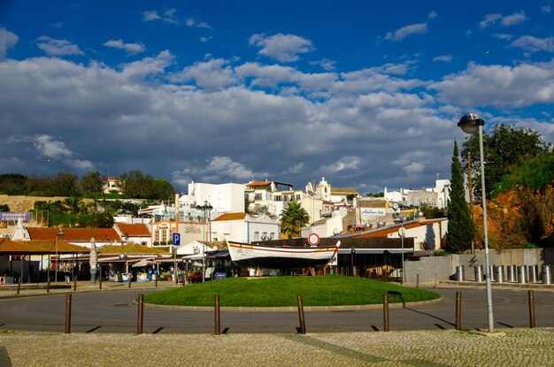 Houses and buildings in city against sky