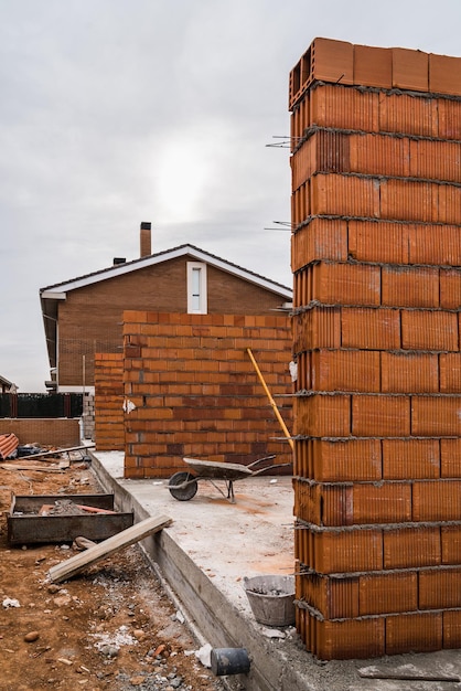 Houses by building against sky