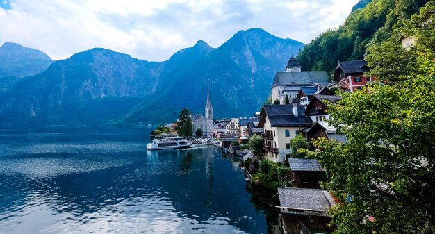 Houses by mountains against sky