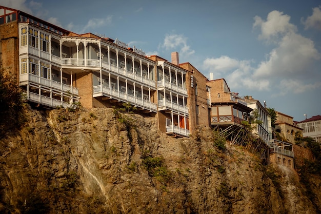 Houses on the edge of a cliff above the river Kura Tbilisi the historic city centerxA