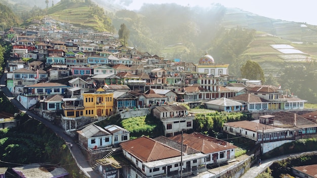 houses neatly arranged on the slopes of the mountain