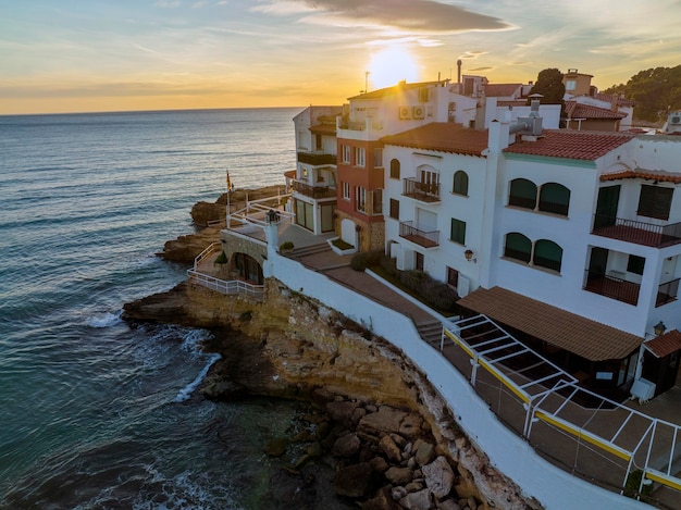 Houses on seashore at sunrise