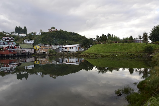 Houses on stilts palafitos reflected in the water in Castro Chiloe Island Patagonia Chile