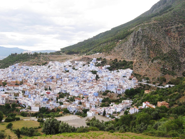 Houses in town against sky