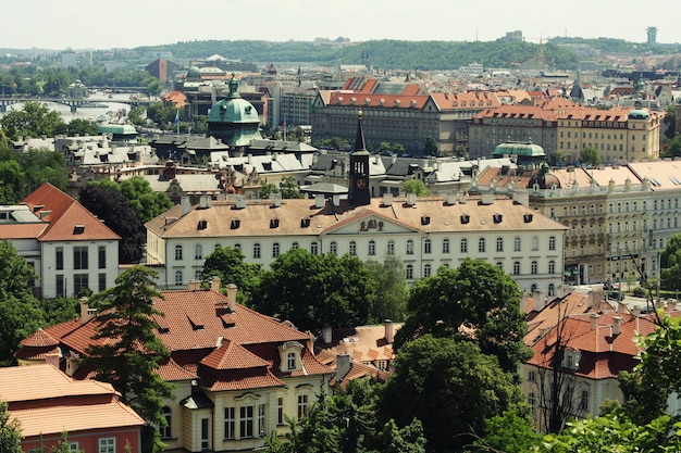 Houses with traditional red roofs in Prague Old Town Square in t