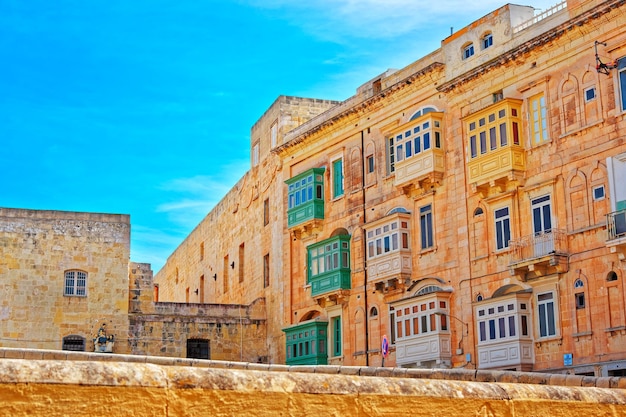 Houses with white and green balconies at Valletta old town, Malta