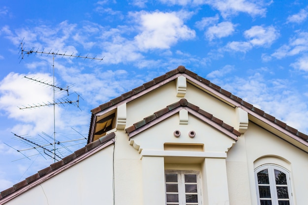 housetop with blue sky background