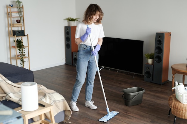 Housewife doing housework in the room