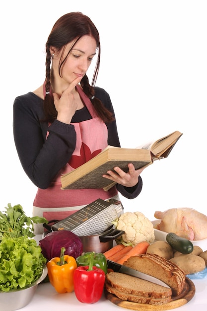 Housewife thinking with a book recipe