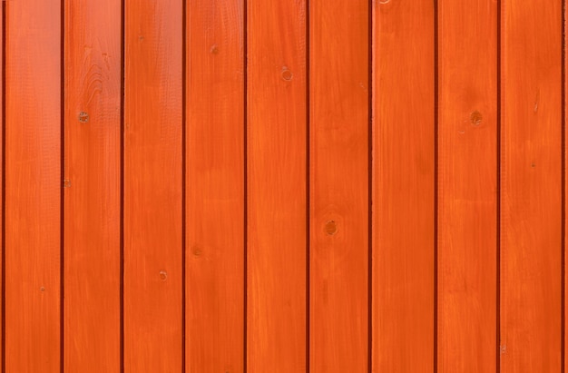 Hout achtergrond. Oranje gelakte planken.