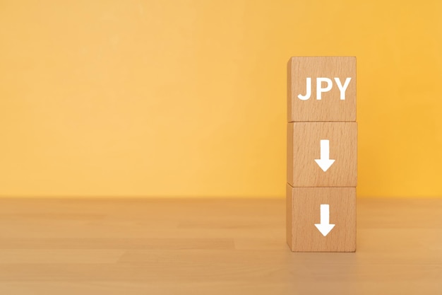 Houten blokken met JPY-tekst van concept.