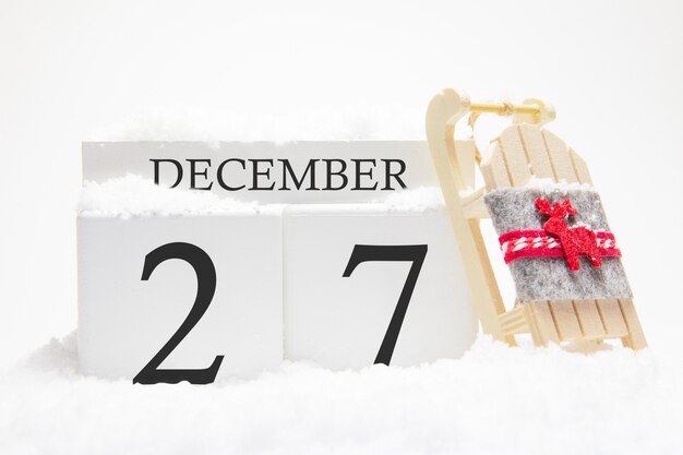 Houten kalender voor 27 december van de wintermaand.