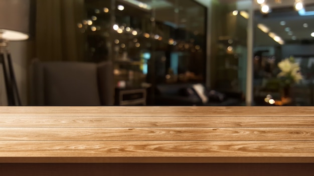Houten tafel op onscherpe achtergrond van moderne restaurantruimte of coffeeshop voor productvertoning mockup