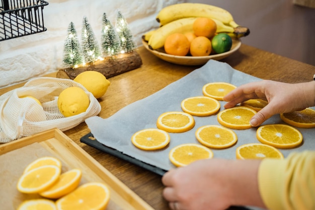 Photo how to dry orange slices for eco friendly zero waste holiday decor close up process of drying