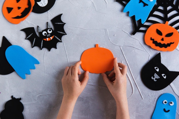 How to make decore for Halloween greetings and fun Children art project DIY concept Step by step photo instruction Pumpkin blank from paper