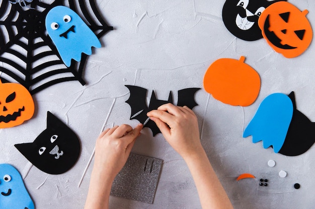 How to make decore for halloween greetings and fun children art\
project diy concept step by step photo instruction step 1 decorate\
bat wings