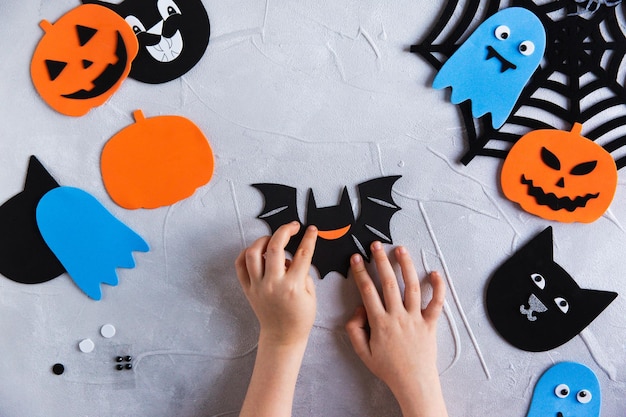 How to make decore for halloween greetings and fun children art\
project diy concept step by step photo instruction step 2 glued\
mouth bat