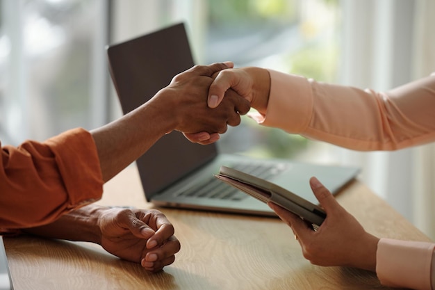 Photo hr manager greeting applicant