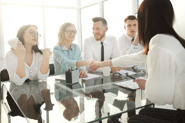 HR Manager shakes hands with the candidate for the vacant position. the concept for the business casting