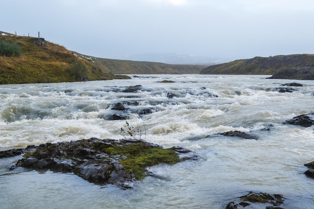 Hrutey island public park near Blonduos town NorthWest of Iceland View during auto trip by Ring Road Spectacular Icelandic landscape with scenic autumn nature and Blanda river with cataracts