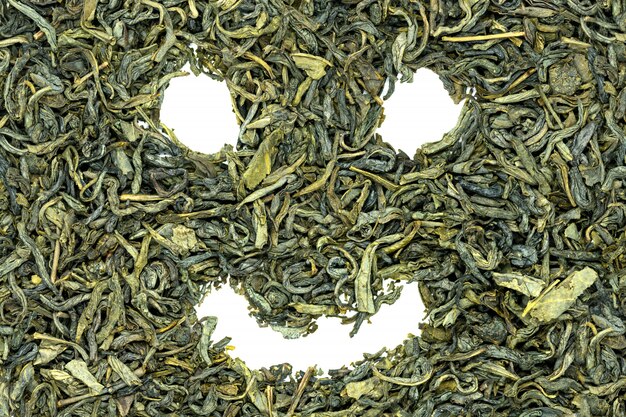 Huangshan Maofeng green tea, funny smiley face, close up. 