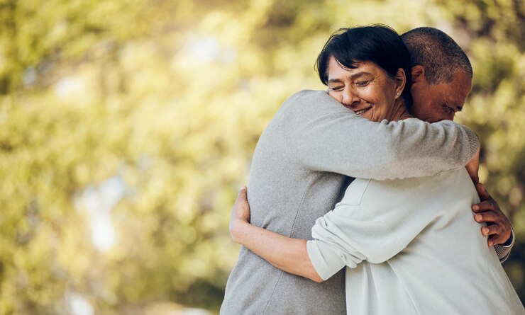Photo hug outdoor and senior couple with love marriage or support with romance relax or relationship relationship old man or elderly woman embrace romantic or retirement with smile or loving together
