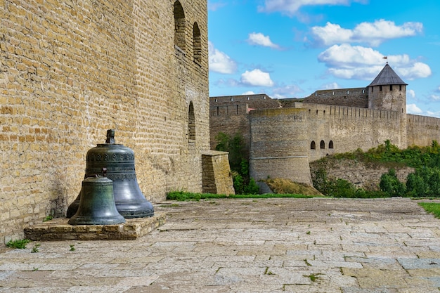 Huge bells next to the wall of Narva Castle in Estonia.