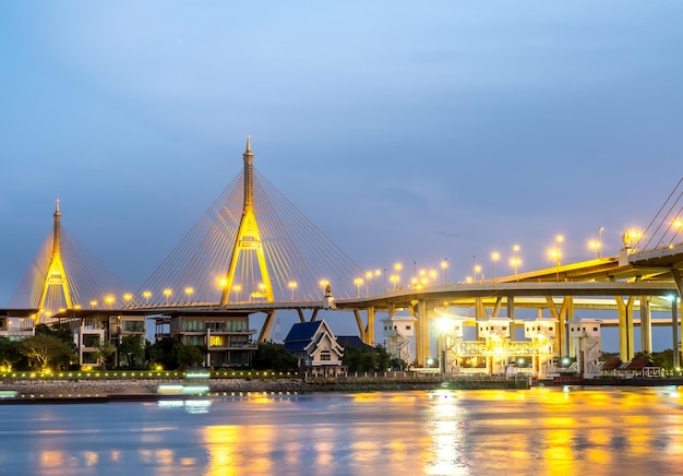 Huge bridge Thai letter mean name 'Bhumiphol' cross Chaophraya river in Bangkok evening twilight