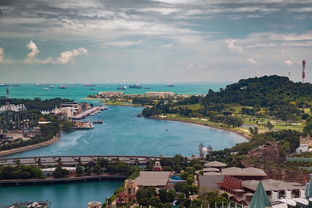 The huge busiest logistic port in singapore plenty of cranes to\
move containers huge cargo ships in ...