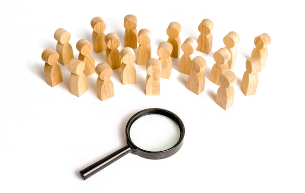 Huge crowd of people stand near a magnifying glass on a white background. 