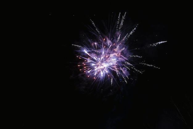 Huge fireworks explosion In front of the black night sky