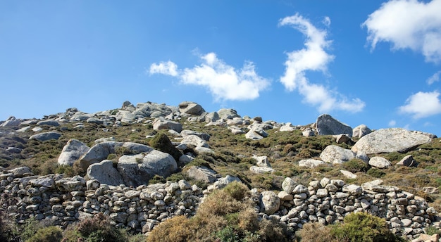 Huge granite volcanic rock Volax village in Tinos island Cyclades Greece Sunny day blue sky