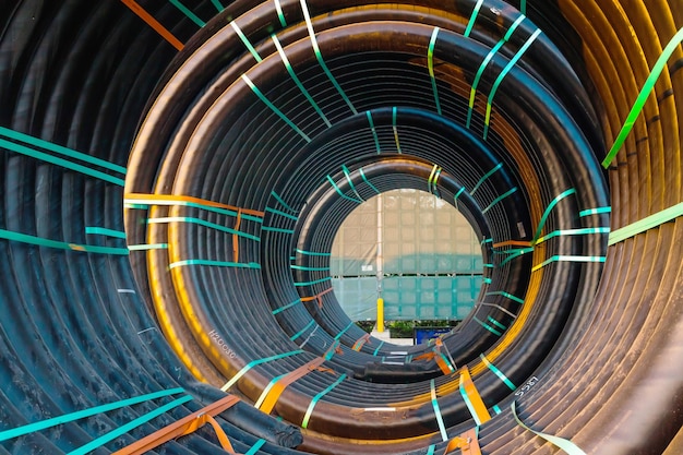 Huge new electrical cables tied into spools closeup