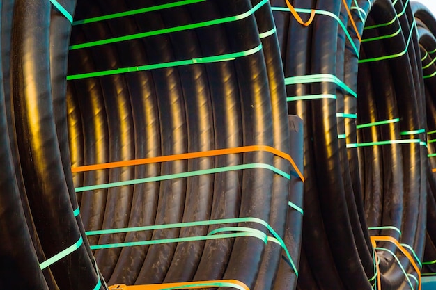 Huge new electrical cables tied into spools closeup