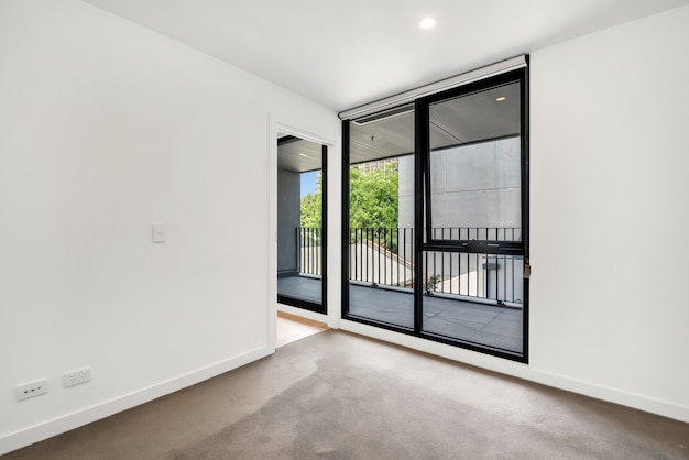 Huge windows and doors of a balcony captured from the room